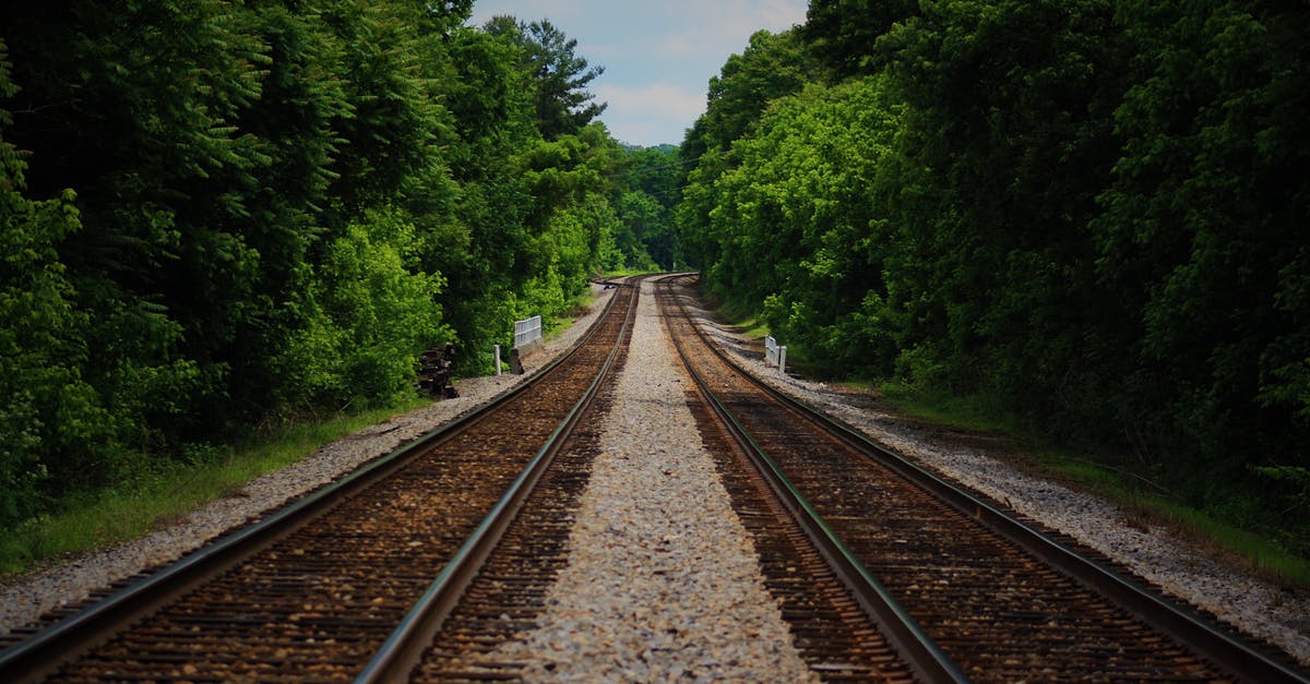 How to tell distance travelled by rail? - Brown Train Railway Between Green Trees at Daytime How to tell distance travelled by rail? - Brown Train Railway Between Green Trees at Daytime