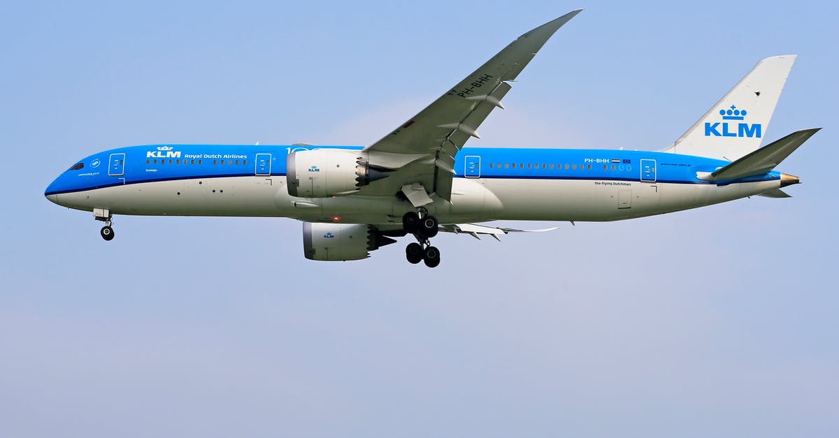 How to tell if your flight has an air-bridge or stairs? - White and Blue Airplane in Mid Air