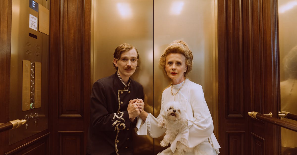 How to tip a concierge or a hotel porter? - Woman in White Long Sleeve Dress Beside Man in Black Long Sleeve Shirt How to tip a concierge or a hotel porter? - Woman in White Long Sleeve Dress Beside Man in Black Long Sleeve Shirt