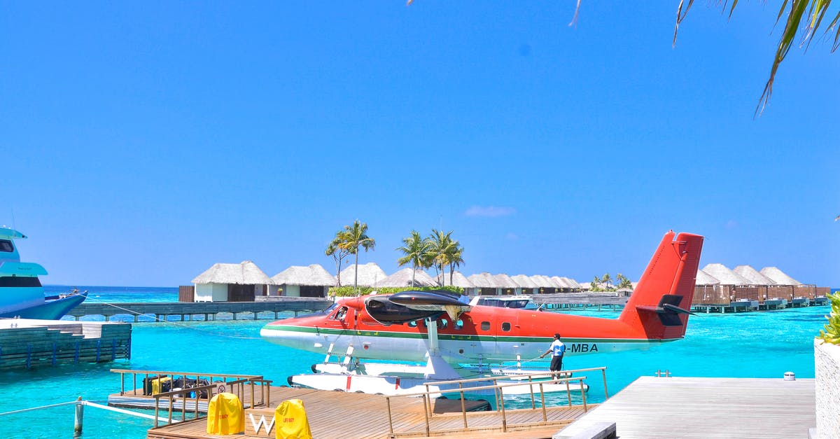 How to travel between the islands of Cape Verde? - White and Red Seaplane on Body of Water