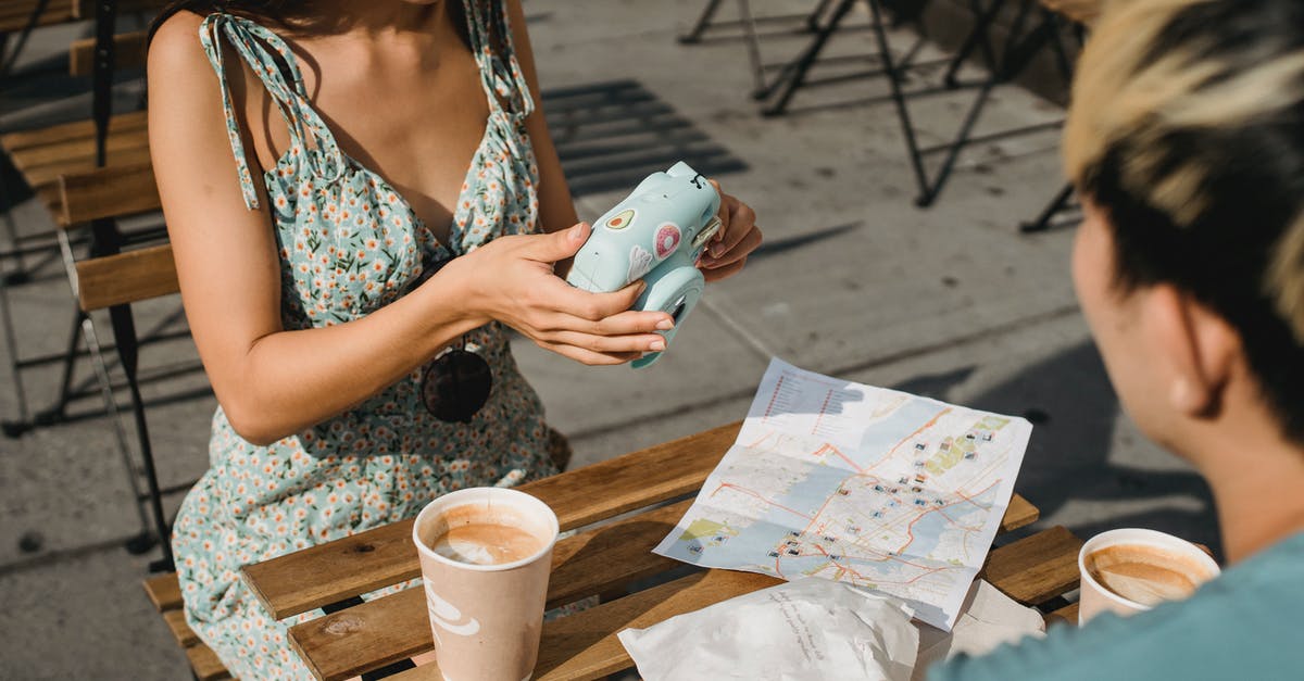 How to travel from Rennes to Poitiers without having to go through Paris? - Crop ethnic couple with photo camera and takeaway coffee How to travel from Rennes to Poitiers without having to go through Paris? - Crop ethnic couple with photo camera and takeaway coffee