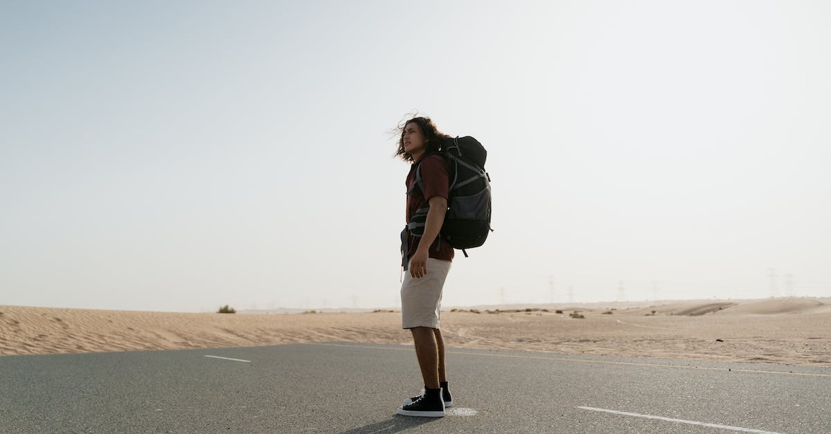 How to travel if you are stateless? - Woman in Black Jacket and White Pants Standing on Gray Asphalt Road How to travel if you are stateless? - Woman in Black Jacket and White Pants Standing on Gray Asphalt Road