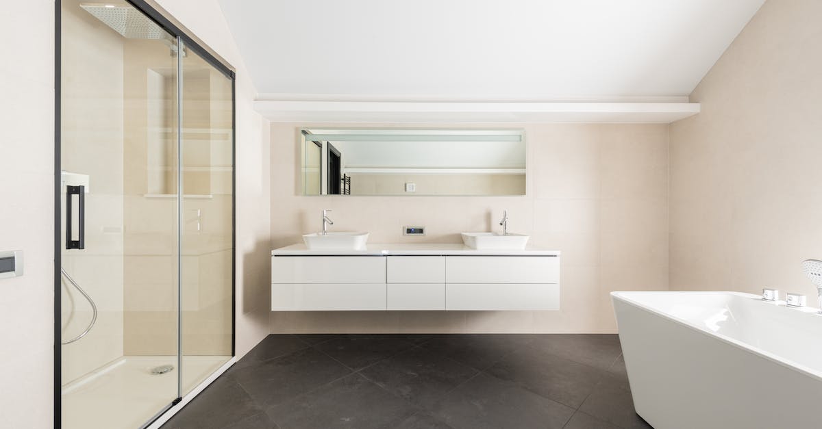 How to use Turkish toilet tap? - Interior of spacious modern bathroom with shower cabin bathtub and minimalist furniture in contemporary apartment How to use Turkish toilet tap? - Interior of spacious modern bathroom with shower cabin bathtub and minimalist furniture in contemporary apartment
