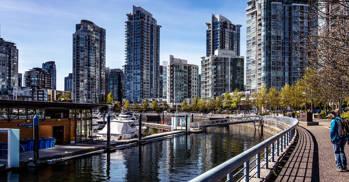 How to visit Capilano Suspension Bridge Park and Stanley Park from Vancouver Airport? - Person Wearing Blue Jeans Besides Gray Steel Fence How to visit Capilano Suspension Bridge Park and Stanley Park from Vancouver Airport? - Person Wearing Blue Jeans Besides Gray Steel Fence