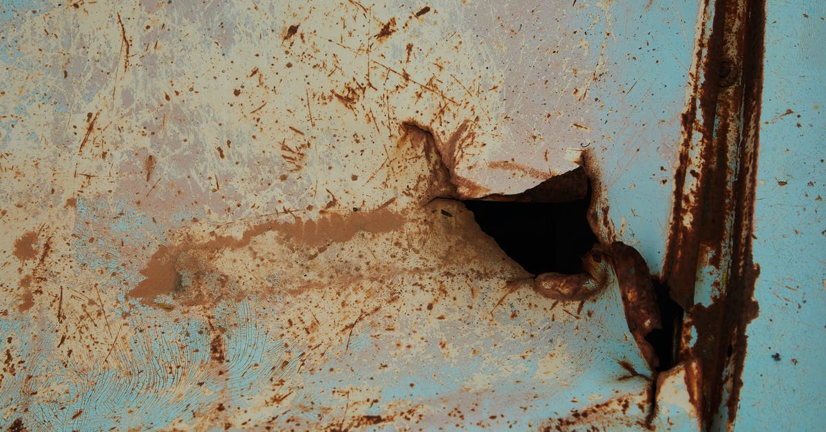 How to visit the Hindenburg Crash Site? - Old rusty metal surface of blue color with scratches and hole in abandoned building How to visit the Hindenburg Crash Site? - Old rusty metal surface of blue color with scratches and hole in abandoned building