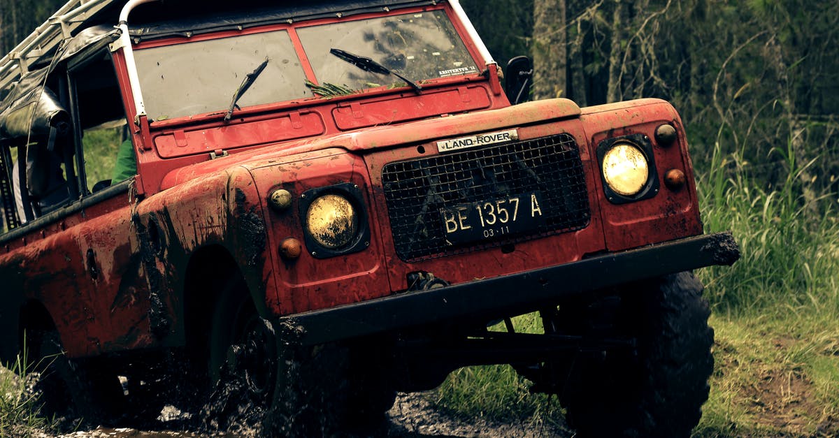 How well is Russias ban on driving a dirty car enforced? - Red Car on Muddy Road Near Trees How well is Russias ban on driving a dirty car enforced? - Red Car on Muddy Road Near Trees