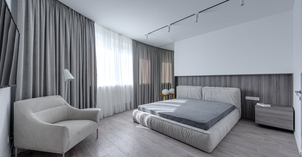 How widely spoken is English in New Caledonia (Nouvelle-Calédonie)? - Interior of stylish room with soft bed against TV set and armchair near window in light flat How widely spoken is English in New Caledonia (Nouvelle-Calédonie)? - Interior of stylish room with soft bed against TV set and armchair near window in light flat
