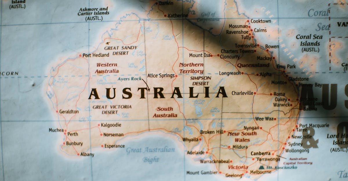 How would you refer to / search on this Alpine region? - Closeup of political map of Australia with cities and regions with borders surrounded by seas and oceans placed on wall in sunny room How would you refer to / search on this Alpine region? - Closeup of political map of Australia with cities and regions with borders surrounded by seas and oceans placed on wall in sunny room