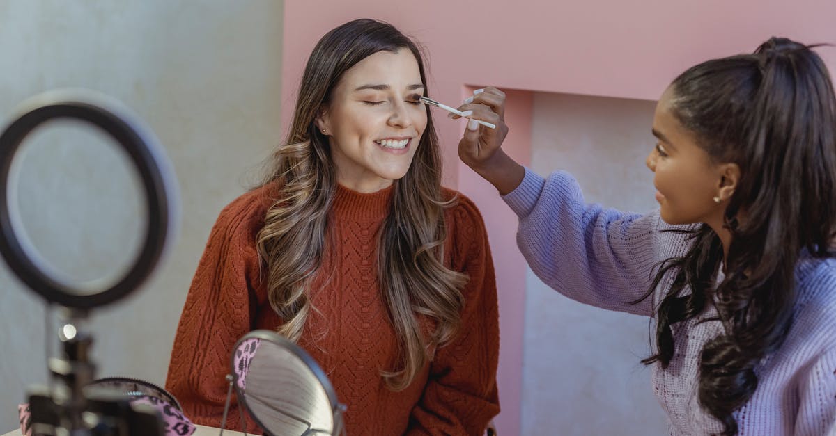 Husband to apply Schengen business visa, can he apply for his wife's visa? - Black beauty blogger applying makeup on model during live broadcast
