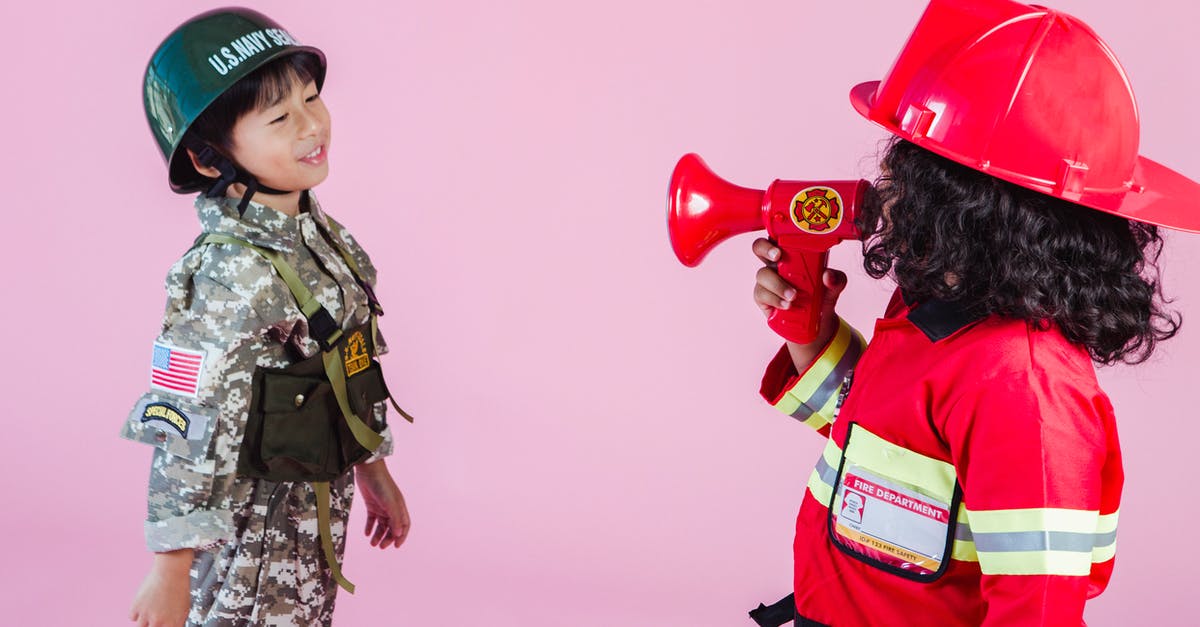 I am a military spouse and I have a friend who is a veteran if we both show our military IDs is my friend allowed to come with me through security - Side view of multiethnic kids wearing navy uniform and firefighter costume with loudspeaker standing together on pink background in hardhats and looking at each other