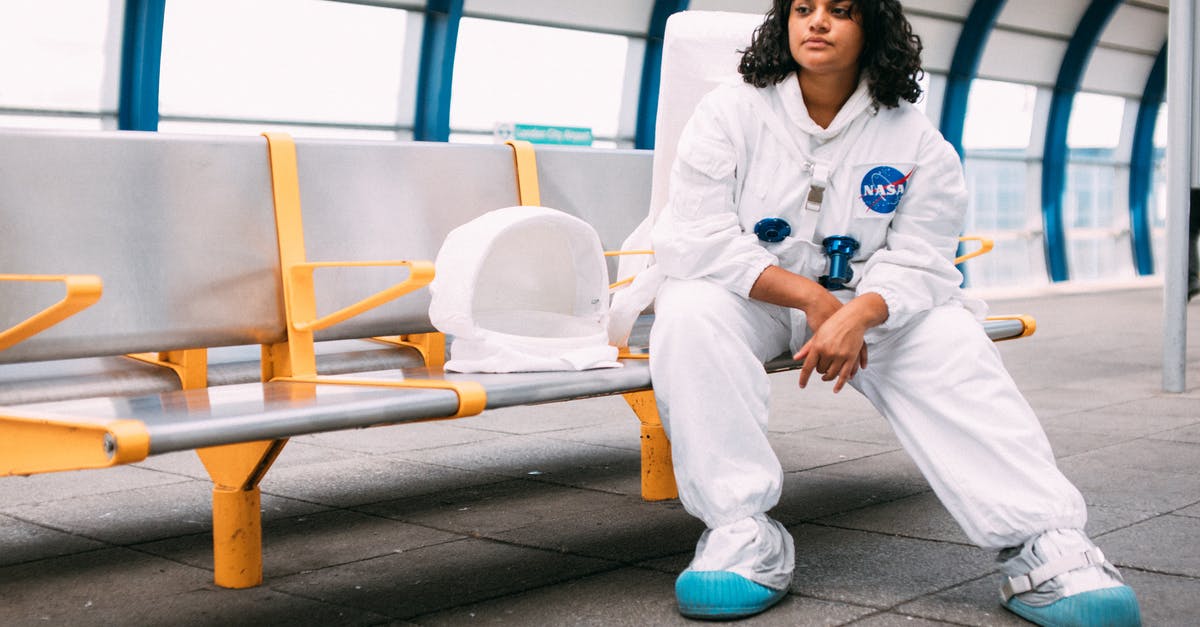 I am an Indian. Can i go out from airport during my 20+ hours layover in London and visit places? [duplicate] - Woman in White Karate Gi Sitting on Yellow Bench