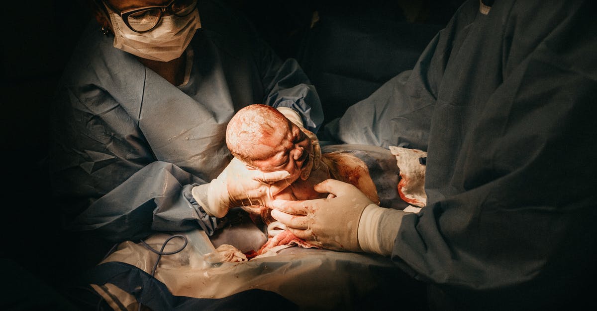 I am applying for a UK Visitor Visa. Can I plan to give birth in an NHS hospital (paying for it), or must I deliver in a fully private hospital? - Woman Giving Birth to Baby Via C-section