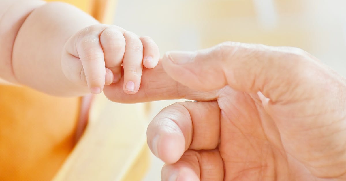 I am British citizen, my children hold a non-EU passport, Schengen visa to Spain was refused, what went wrong? - Person Touching Hand of Baby I am British citizen, my children hold a non-EU passport, Schengen visa to Spain was refused, what went wrong? - Person Touching Hand of Baby