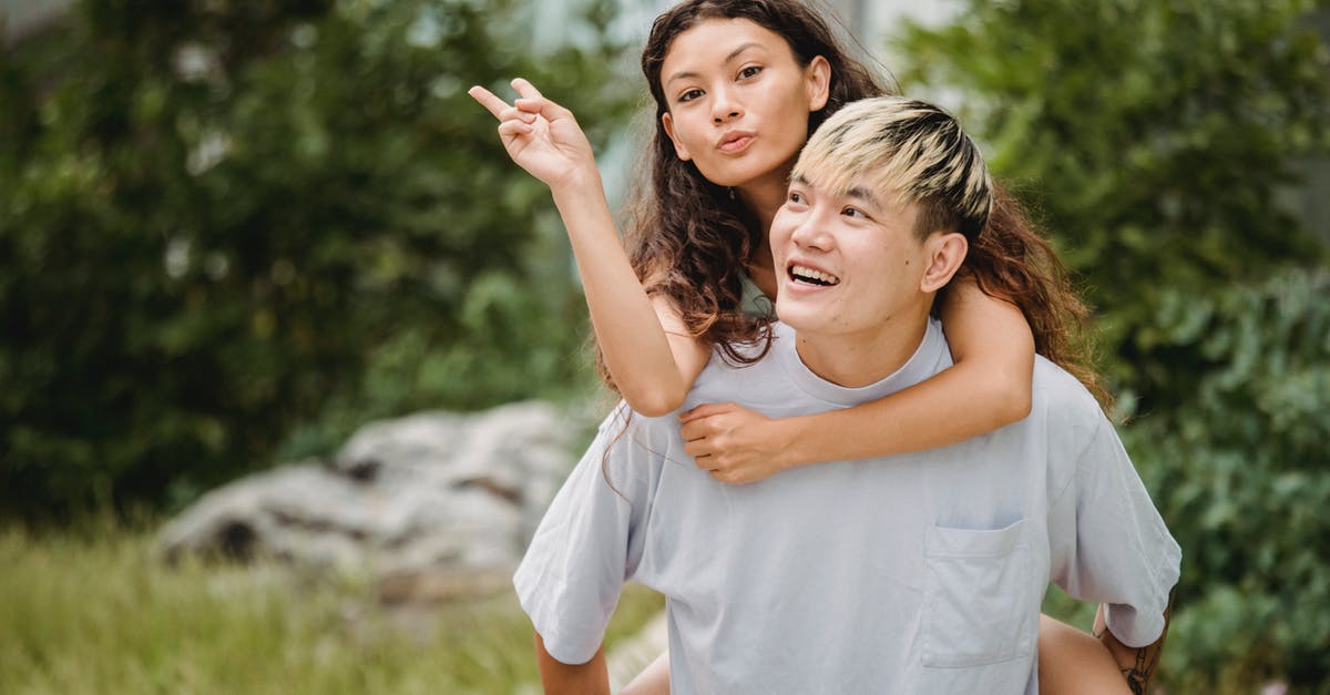 I had my passport renewed before the expiration date and now I have two valid passports [closed] - Happy ethnic guy carrying girlfriend on back in park