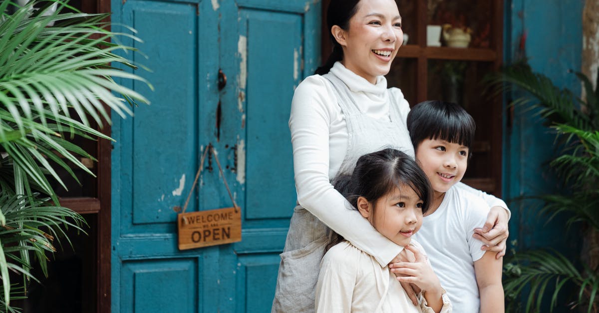 I have a double entry visa but need to enter China three times. What can I do? - Photo of Woman Smiling While Hugging Her Children I have a double entry visa but need to enter China three times. What can I do? - Photo of Woman Smiling While Hugging Her Children