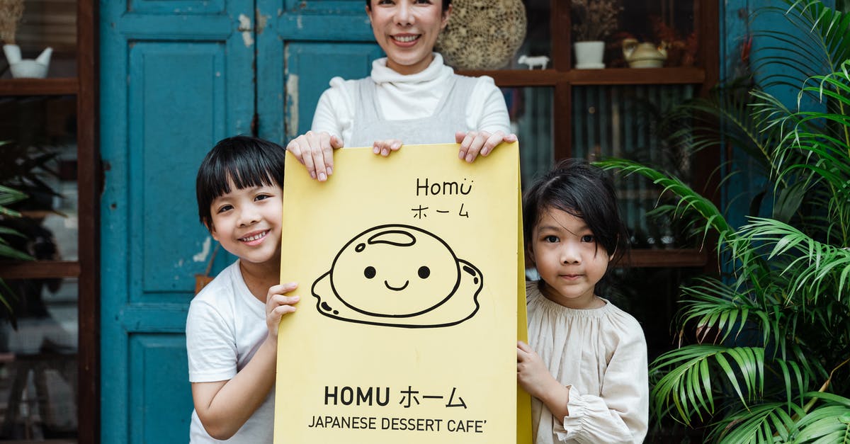 I have a double entry visa but need to enter China three times. What can I do? - Photo of Family Smiling While Holding Signage I have a double entry visa but need to enter China three times. What can I do? - Photo of Family Smiling While Holding Signage