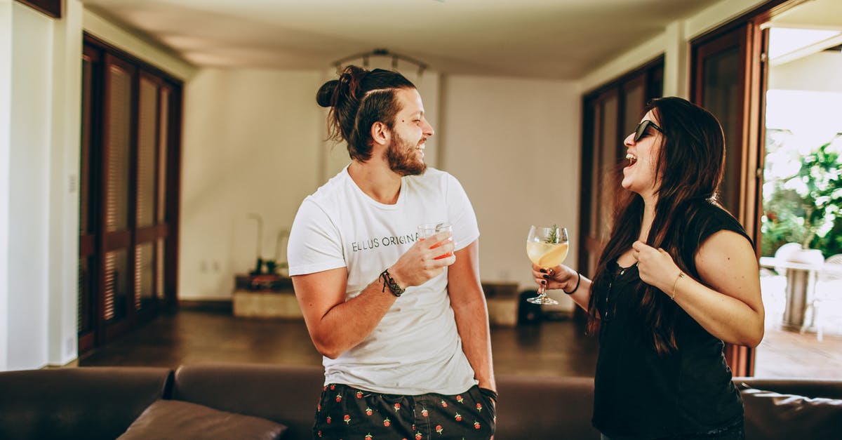 I have overstayed my holiday visa in the U.S and want to go home to England; how do I go about doing so? - Young man and woman in casual outfit smiling and looking at each other while having fun at home during romantic meeting on daytime
