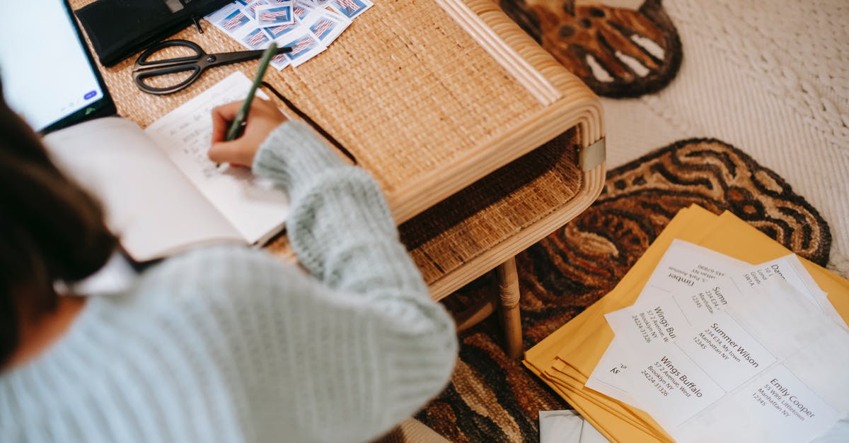 I have two passports, one is where the visa stamp is and other has no visa stamp. What is the step to use it? [duplicate] - Faceless ethnic female writing information in notebook near envelope parcels