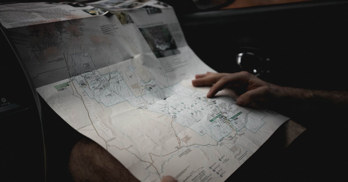 I lost my Chilean tourist card! What do I do? - Crop man with map in automobile I lost my Chilean tourist card! What do I do? - Crop man with map in automobile