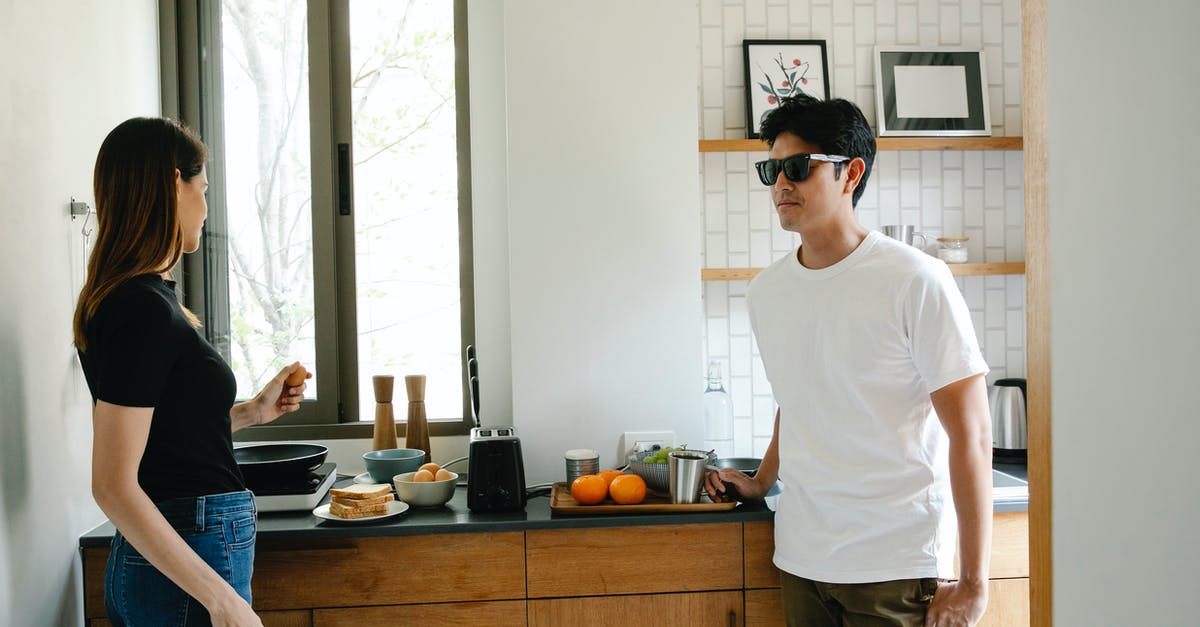 I married an Asian citizen and I'm European. Does my husband need a visa to come to Europe? - Young Asian man with vision loss in black glasses standing in kitchen with wife preparing breakfast while spending morning together at home I married an Asian citizen and I'm European. Does my husband need a visa to come to Europe? - Young Asian man with vision loss in black glasses standing in kitchen with wife preparing breakfast while spending morning together at home