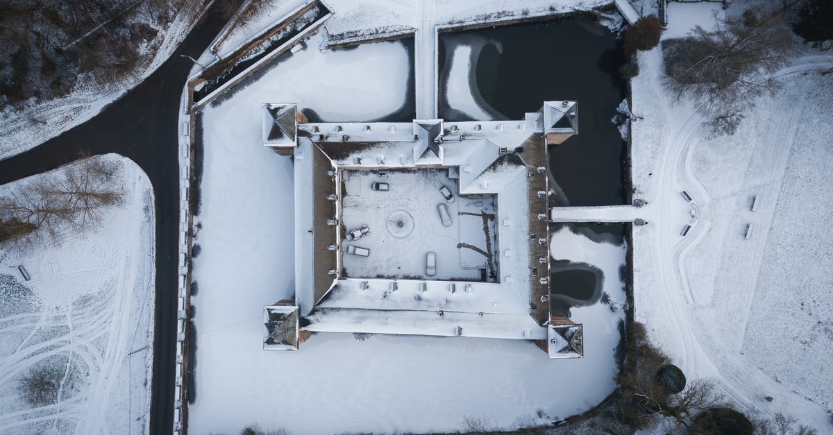 I saw a lakeside castle or hotel from the air, north of Newark. What is it? - Drone view of villa with vehicles on snowy land against leafless trees and roadways in wintertime I saw a lakeside castle or hotel from the air, north of Newark. What is it? - Drone view of villa with vehicles on snowy land against leafless trees and roadways in wintertime