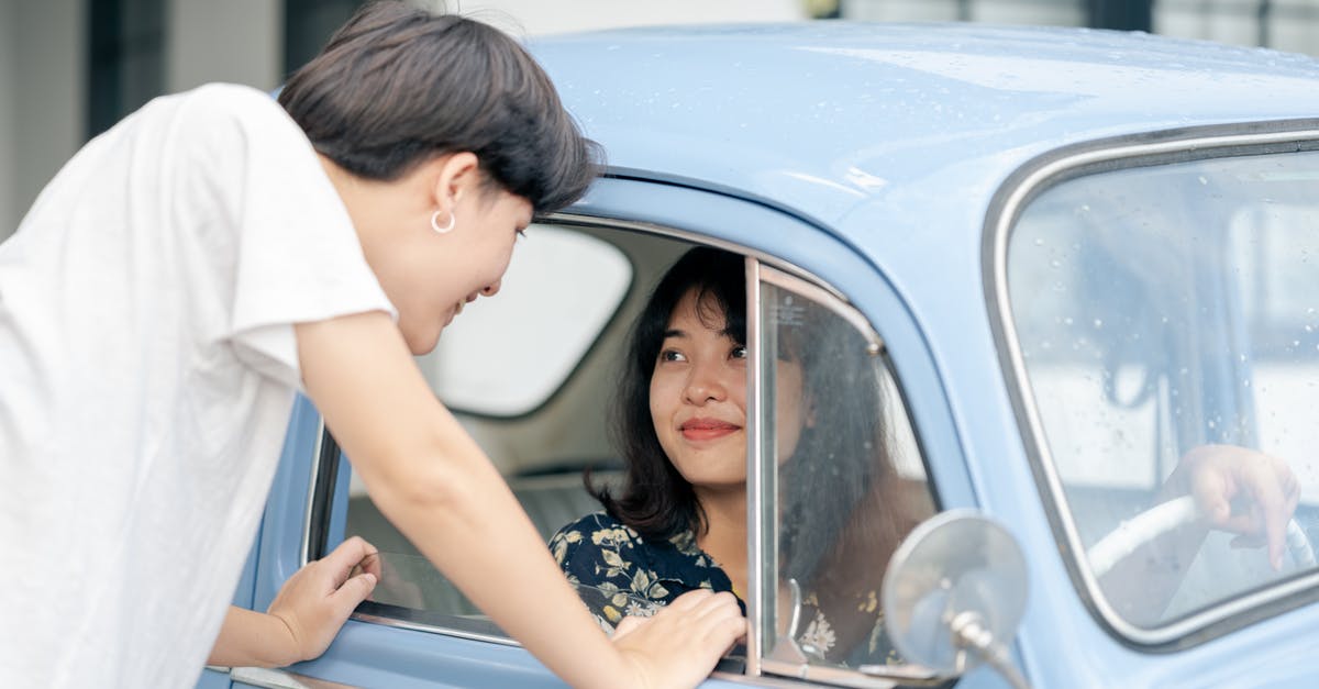I was banned for drunk driving 4 years ago in the UK. Will this affect my Russian visa application? - Photo of Woman Inside the Car While Looking at Her Boyfriend