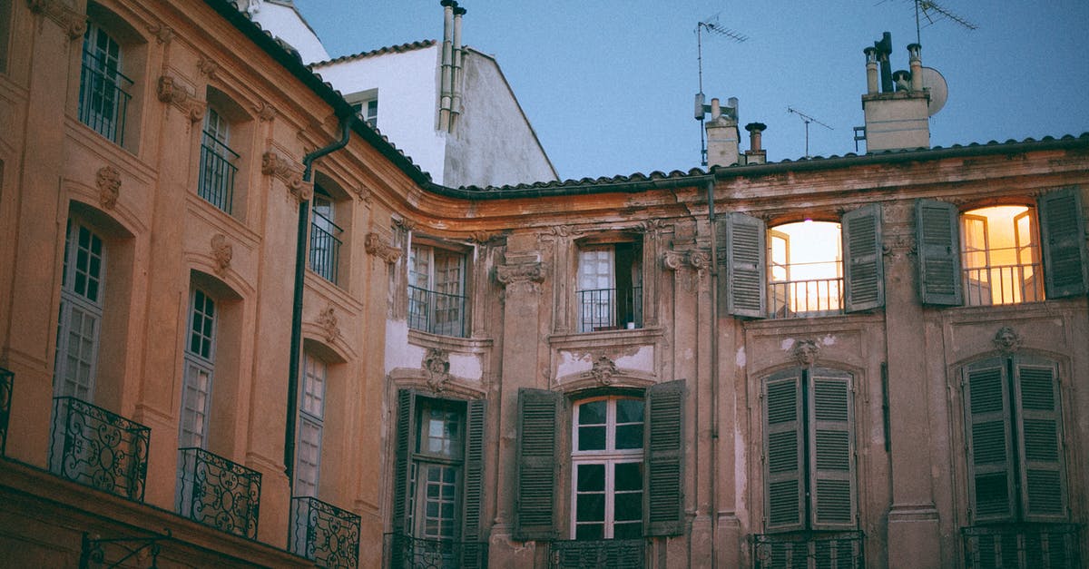 I will go from Montparnasse gare from CDG airport., France - From below of facade of famous palace with pillars and shutters on windows and weathered wall located in Aix en Provence France I will go from Montparnasse gare from CDG airport., France - From below of facade of famous palace with pillars and shutters on windows and weathered wall located in Aix en Provence France