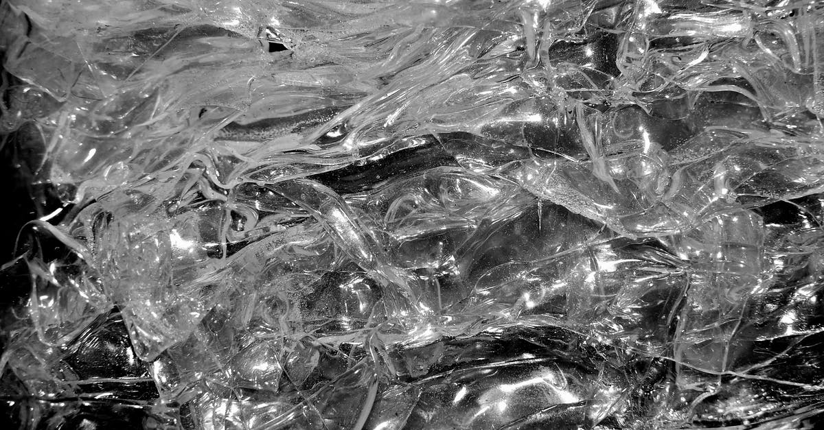ICE from Frankfurt to Limburg - From above of transparent clear shiny crystal plastic shapeless texture for abstract background ICE from Frankfurt to Limburg - From above of transparent clear shiny crystal plastic shapeless texture for abstract background