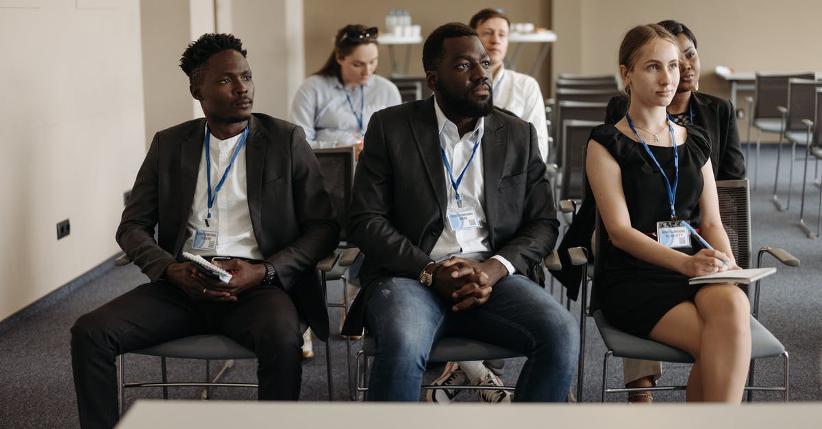 ID requirement on your person in the UK? - Businesspeople Attending a Business Seminar ID requirement on your person in the UK? - Businesspeople Attending a Business Seminar