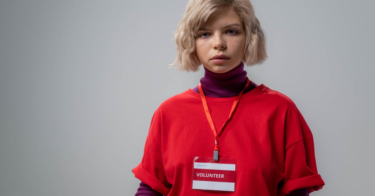 ID requirement on your person in the UK? - Photo of a Woman with a Volunteer Id ID requirement on your person in the UK? - Photo of a Woman with a Volunteer Id