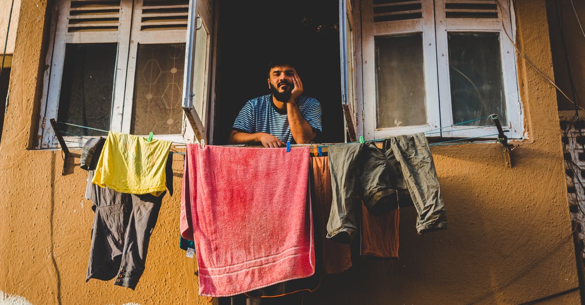 Ideas for versatile clothes in northern India - Man By An Open Window With Assorted Clothing Hanging On Clotheslines Ideas for versatile clothes in northern India - Man By An Open Window With Assorted Clothing Hanging On Clotheslines