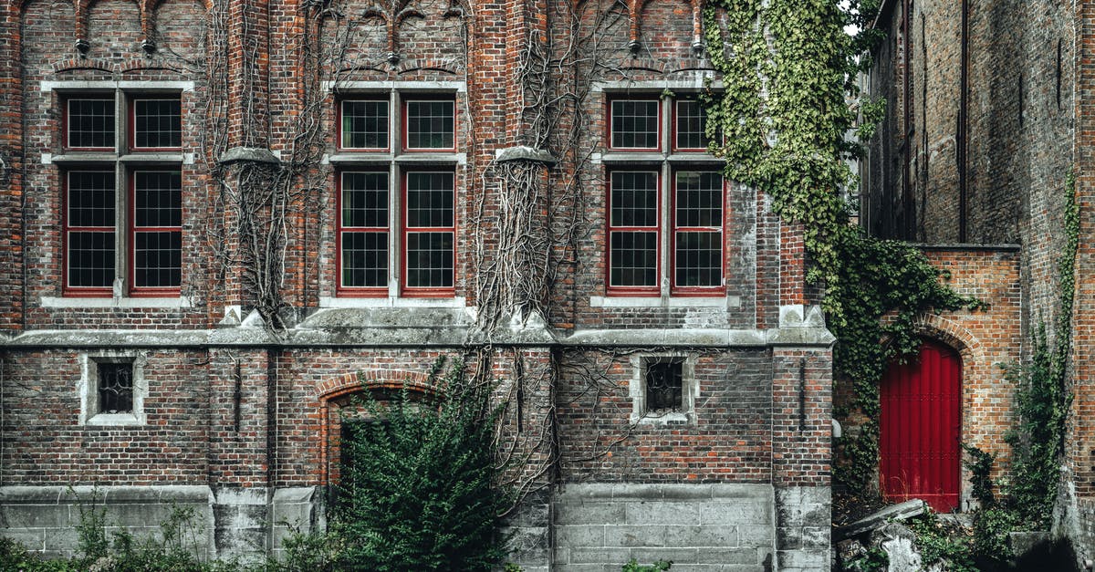 Identify a WWII-time building in Belgium - Fragment of exterior of ancient historic brick building with ornamental walls located on Steenhouwers Canal in Bruges Identify a WWII-time building in Belgium - Fragment of exterior of ancient historic brick building with ornamental walls located on Steenhouwers Canal in Bruges