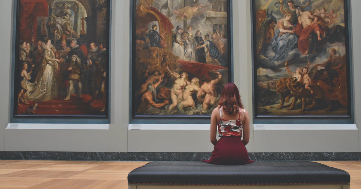 Identify location of old painting - Woman Sitting on Ottoman in Front of Three Paintings Identify location of old painting - Woman Sitting on Ottoman in Front of Three Paintings
