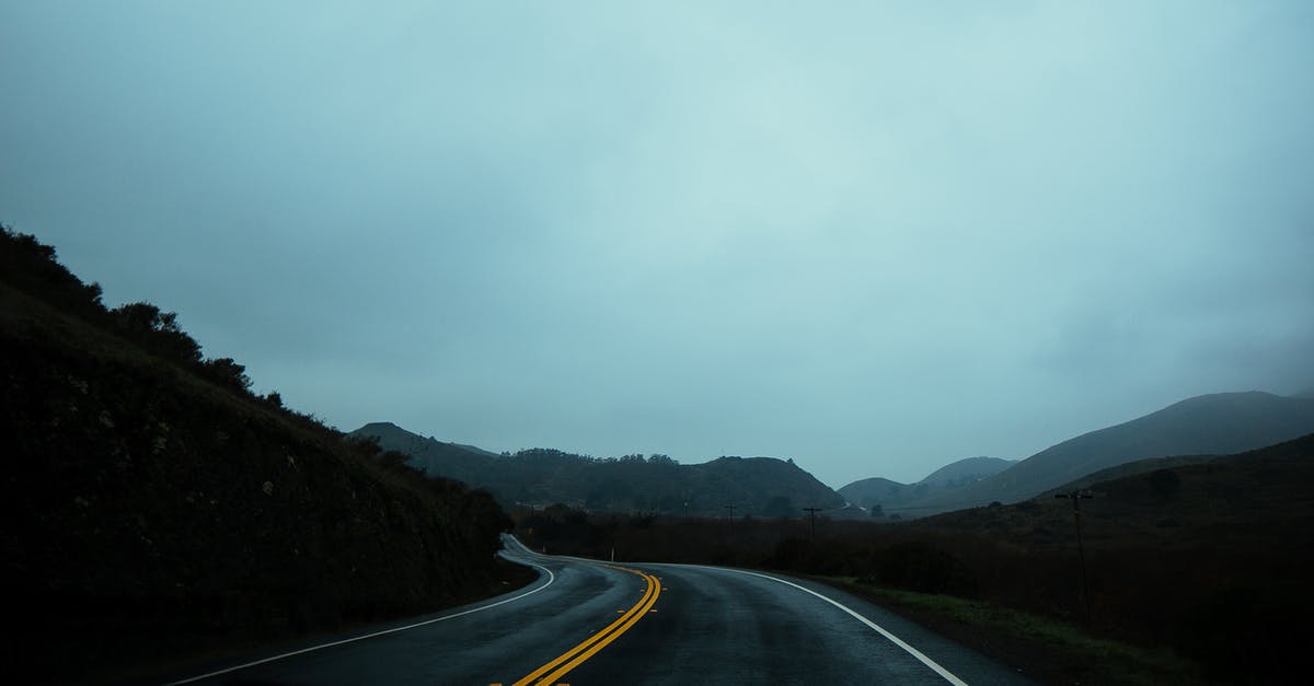 If a country does not require a visa on arrival, how do they keep track of the traveller? - Curvy asphalt roadway going amidst green lush hills in highlands on haze day If a country does not require a visa on arrival, how do they keep track of the traveller? - Curvy asphalt roadway going amidst green lush hills in highlands on haze day