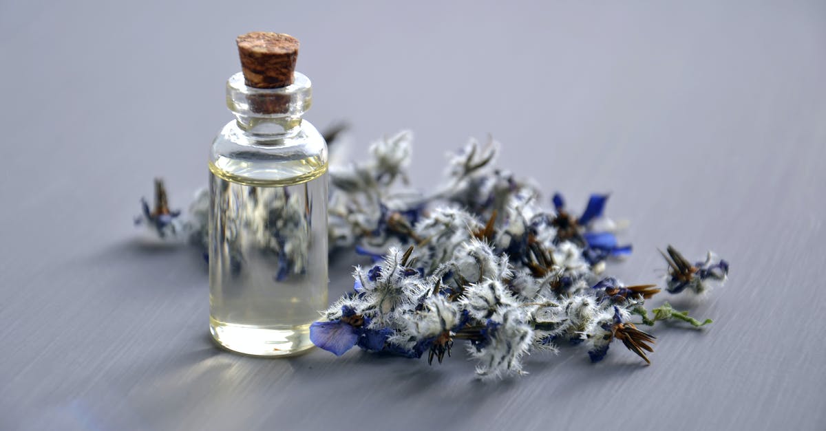 if i have a 5oz container of cologne (liquid), but it is only 15ml, will i be able to take it on the plane? [duplicate] - Selective Focus Photo of Bottle With Cork Lid