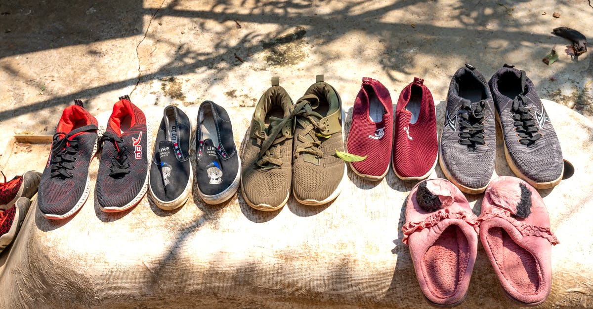 If I have Schengen visa, can I enter Schengen area from different country? [duplicate] - Various footwear for selling placed on stone on street