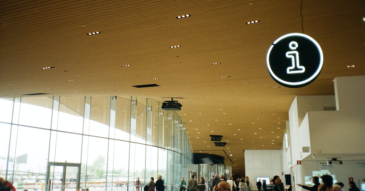 If I provide info to an immigration officer, does he enter it into a database? [closed] - People Walking Inside Well-lit Building