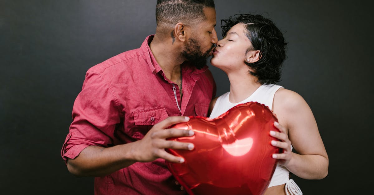 If my Schengen visa insurance expires on the day of my departure? - Couple Kissing While Holding a Red Heart Shaped Balloon If my Schengen visa insurance expires on the day of my departure? - Couple Kissing While Holding a Red Heart Shaped Balloon