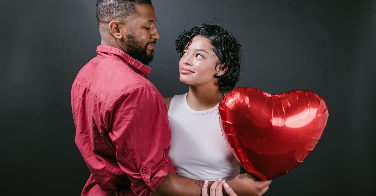 If my Schengen visa insurance expires on the day of my departure? - Couple Looking at Each Other While Holding a Red Heart Shaped Balloon If my Schengen visa insurance expires on the day of my departure? - Couple Looking at Each Other While Holding a Red Heart Shaped Balloon
