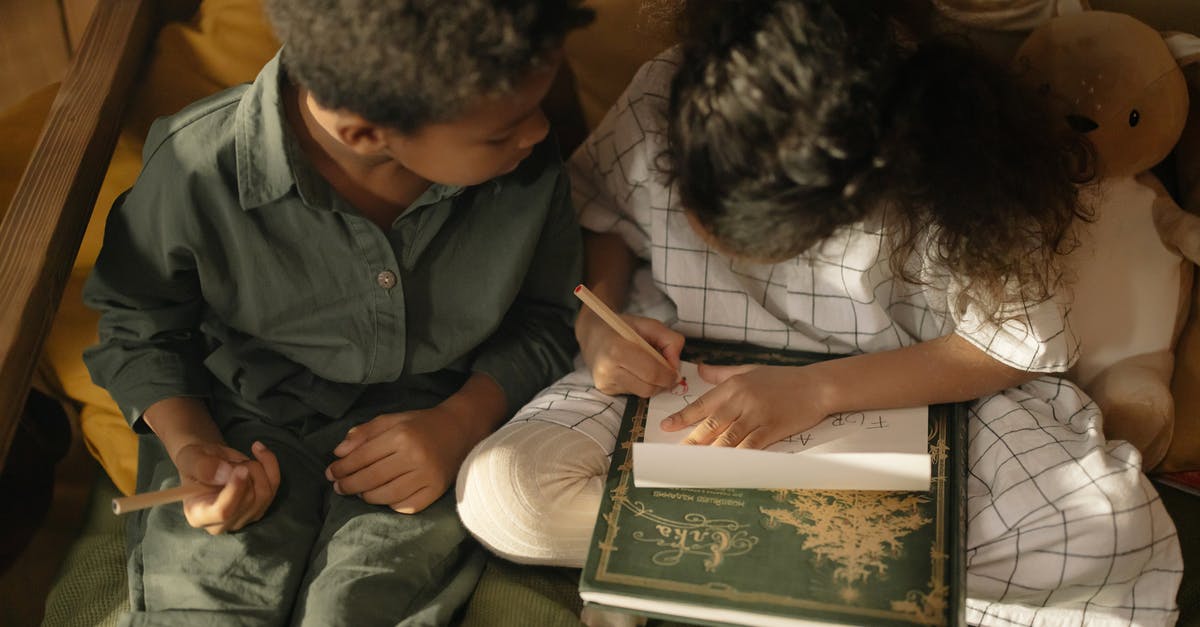If my son is attending a nursery school, do I need to provide a letter from the school to receive a Schengen visa? - Man in Blue Button Up Shirt Sitting Beside Woman in White Shirt If my son is attending a nursery school, do I need to provide a letter from the school to receive a Schengen visa? - Man in Blue Button Up Shirt Sitting Beside Woman in White Shirt