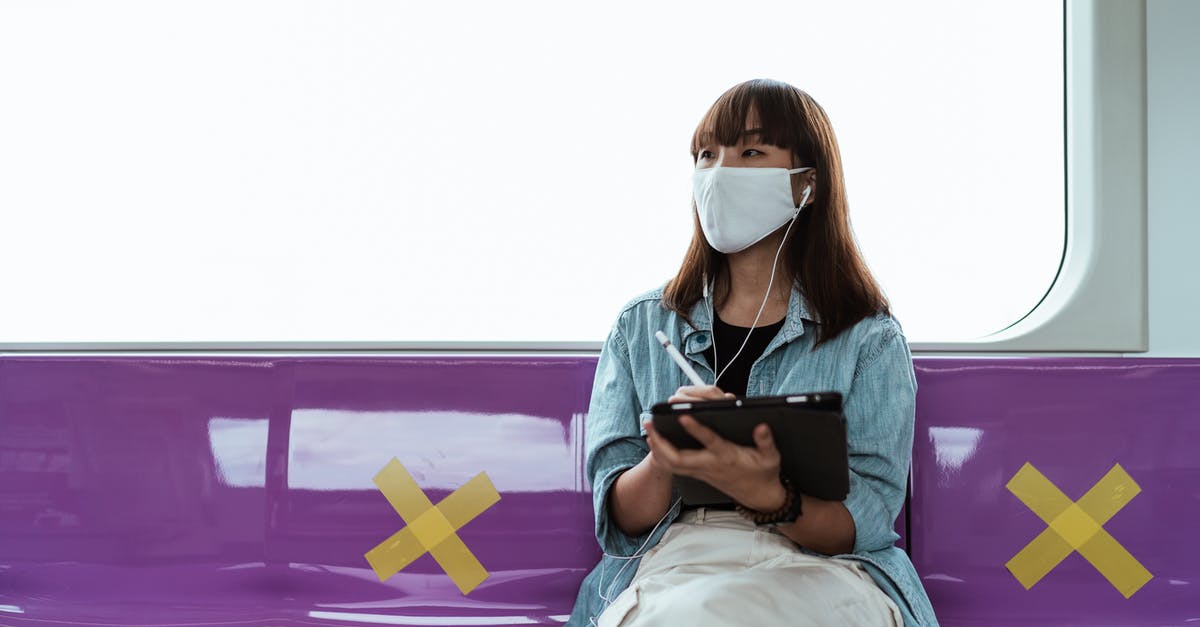 If my train is cancelled and replaced, must I take the indicated replacement train when I have a Sparpreis ticket? - Woman Wearing a Face Mask and Using a Tablet If my train is cancelled and replaced, must I take the indicated replacement train when I have a Sparpreis ticket? - Woman Wearing a Face Mask and Using a Tablet