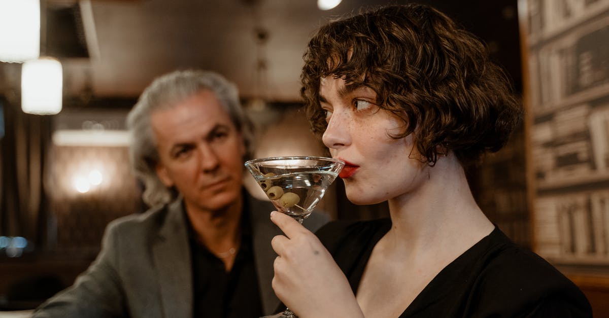 If someone becomes unconscious due to a cocktail of prescription medication, would they be held liable for holding up the flight? [closed] - A Woman Drinking Cocktail