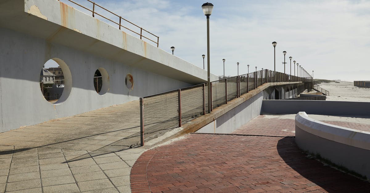Immigration line selection at port of entry in the USA - Pier with concrete tile and streetlights