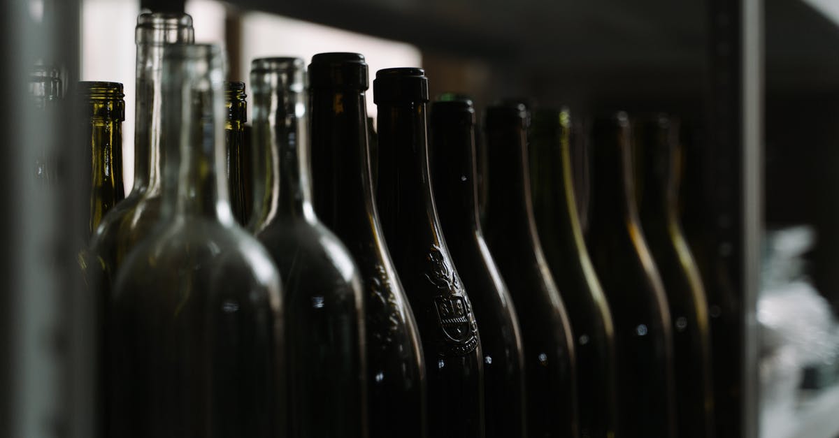 Importing duty-free 750 ml wine bottles into Turkey - Black Glass Bottles on Table Importing duty-free 750 ml wine bottles into Turkey - Black Glass Bottles on Table