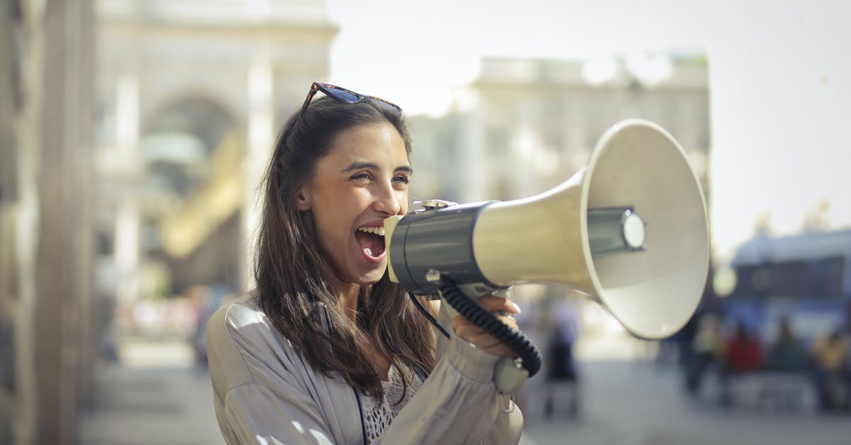 In an emergency, how do I find and share my position? - Cheerful young woman screaming into megaphone In an emergency, how do I find and share my position? - Cheerful young woman screaming into megaphone
