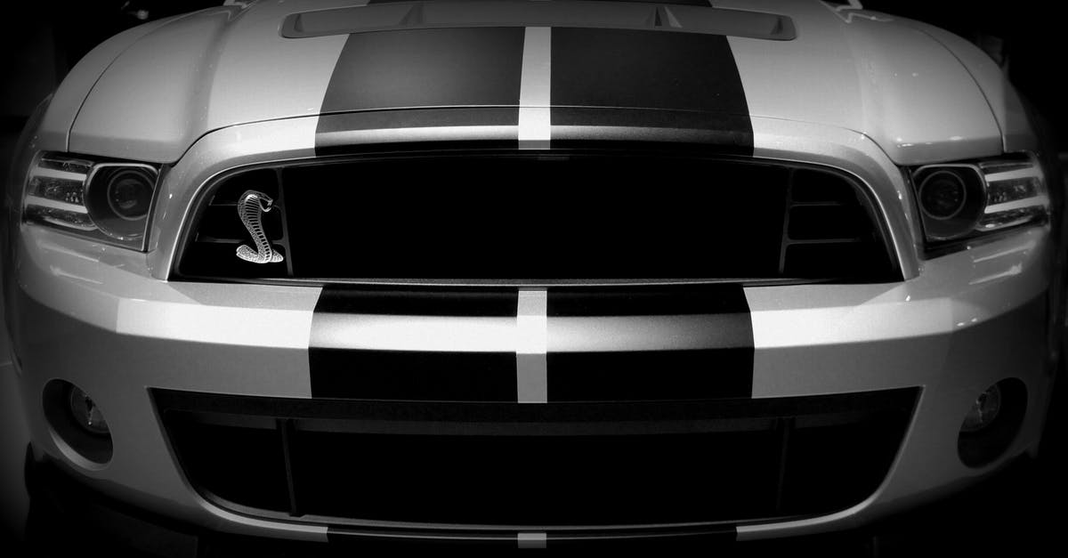 In California, is it always legal to drive with your car headlight on? - Grayscale Photo of Dodge Viper