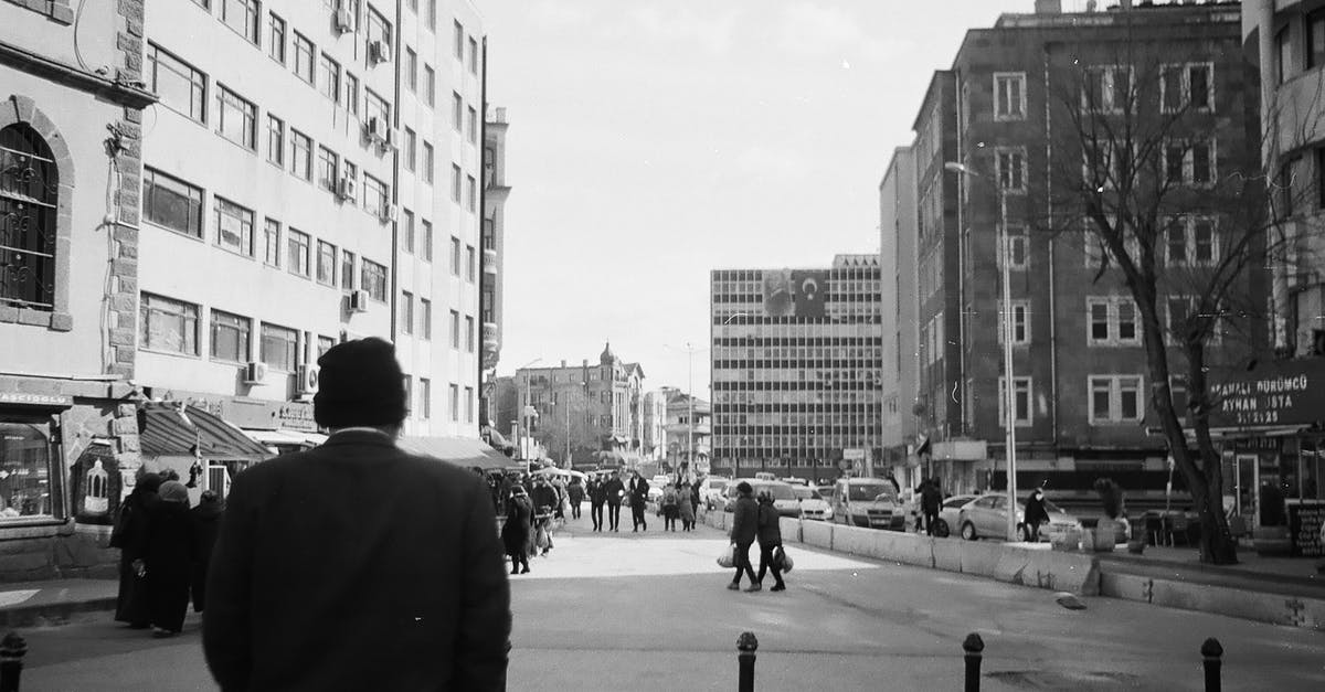In Germany, are there any cities or special regions in cities which are dangerous for non-white people to go to? - Black and White Photo of City Street In Germany, are there any cities or special regions in cities which are dangerous for non-white people to go to? - Black and White Photo of City Street