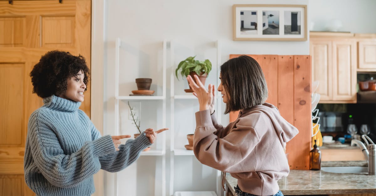 In Japan, is it considered rude to talk on the train? - Irritated multiracial women fighting in apartment In Japan, is it considered rude to talk on the train? - Irritated multiracial women fighting in apartment