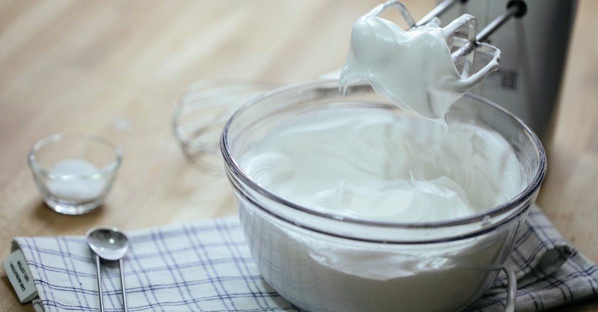 In Mongolia, are dairy products offered to tourists typically processed? - Composition on bowl with delicious whipped cream near mixer In Mongolia, are dairy products offered to tourists typically processed? - Composition on bowl with delicious whipped cream near mixer
