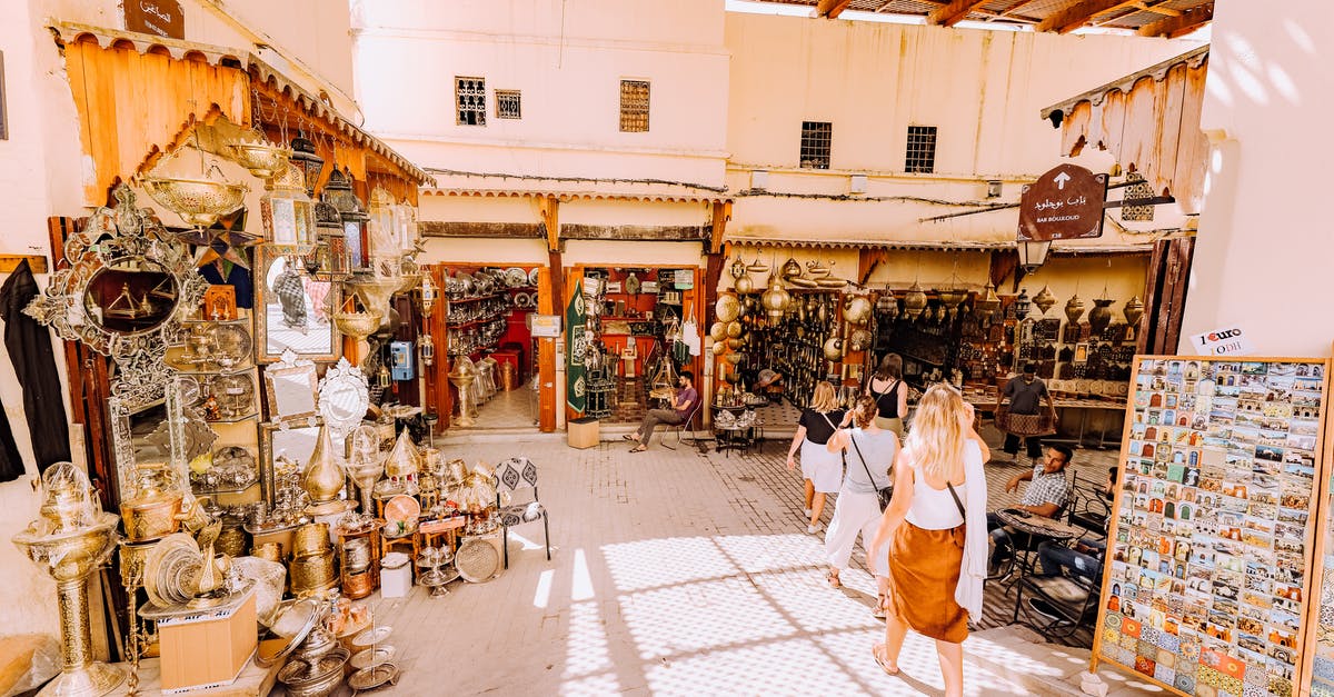 In Mongolia, are dairy products offered to tourists typically processed? - Photo of People Walking in Marketplace In Mongolia, are dairy products offered to tourists typically processed? - Photo of People Walking in Marketplace